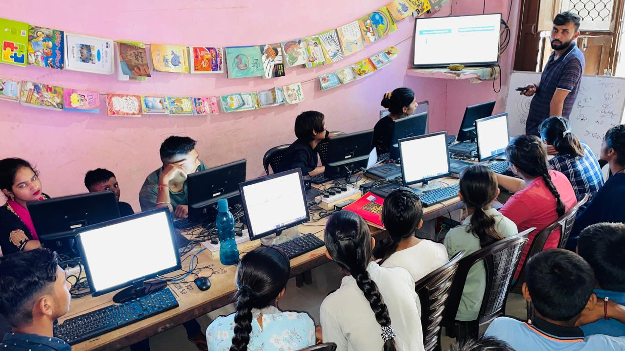 An educator teaching students in a community microschool in Haryana