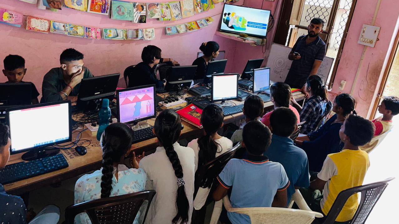 Students getting digital education at ApniPathshala’s learning pod.