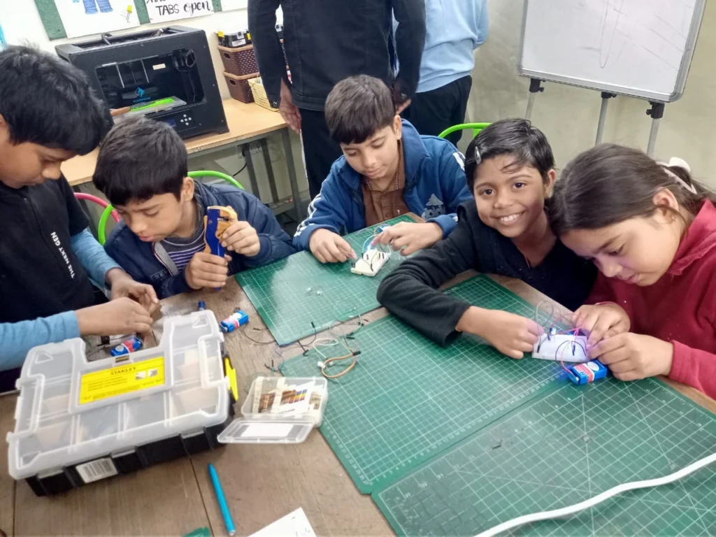 “Students building simple electronic circuits in a hands-on classroom”