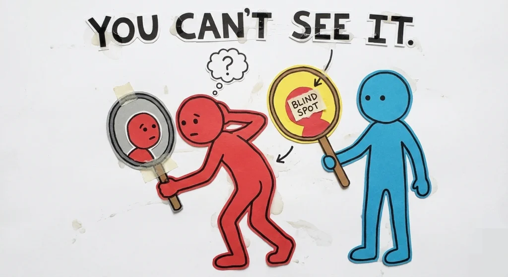 Person unable to see own blind spot while another points it out
