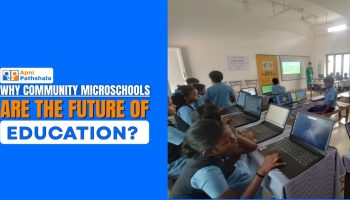 Community microschool classroom with students using laptops for digital learning.